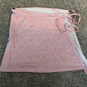 Side tie swimsuit cover up with cute white/purple flowers. Sz M